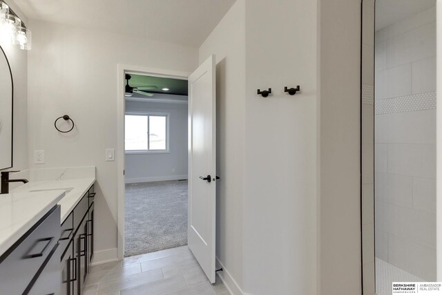 bathroom with vanity and ceiling fan