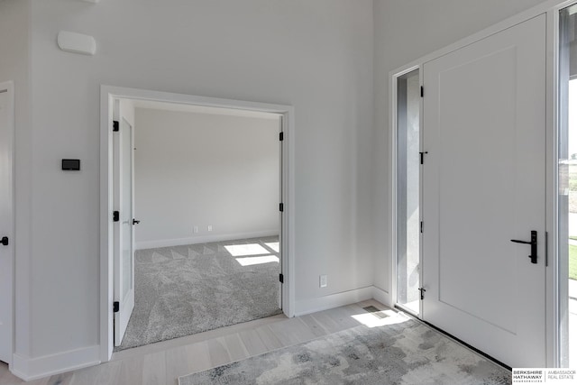 view of carpeted foyer