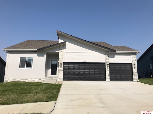 view of front facade with a front lawn and a garage