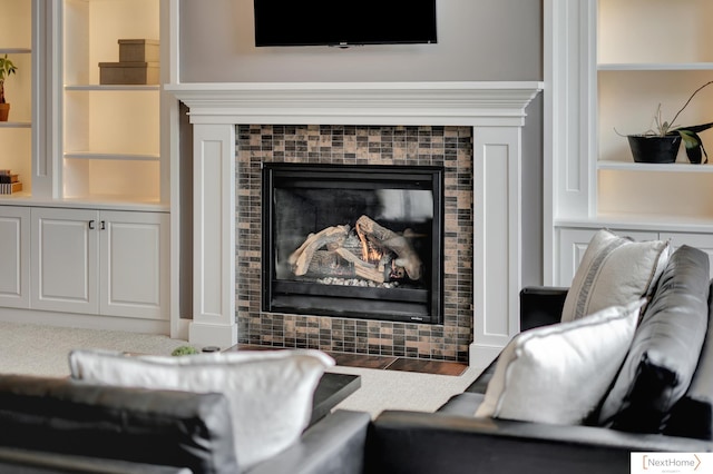 interior space with a fireplace and built in shelves