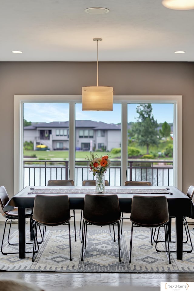 dining space featuring a water view