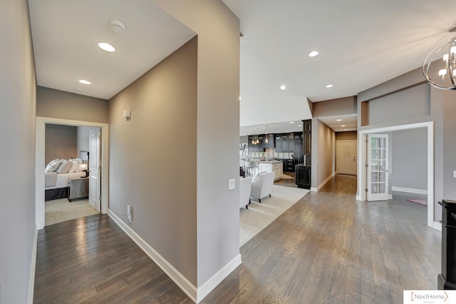 hall with hardwood / wood-style flooring