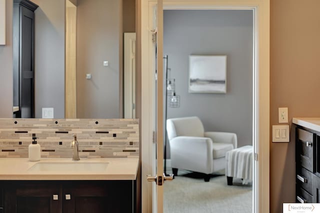 bathroom featuring decorative backsplash and vanity