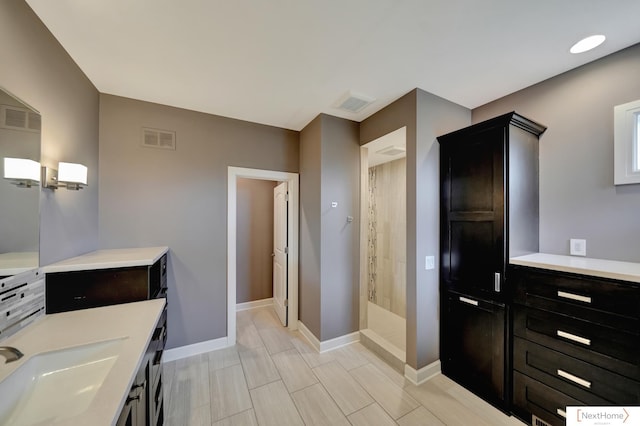 bathroom featuring vanity and a shower with shower curtain