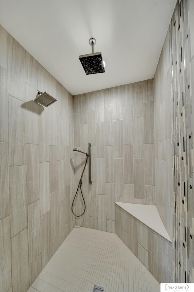 bathroom with tiled shower