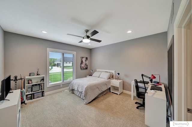 bedroom featuring ceiling fan and light colored carpet