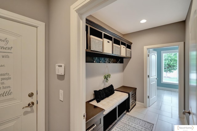 mudroom with light tile patterned flooring