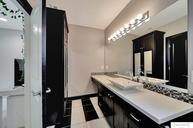 bathroom featuring tile patterned flooring and vanity