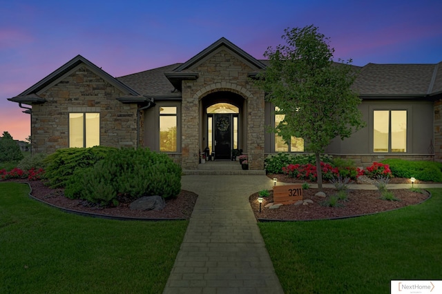 view of front of property with a yard