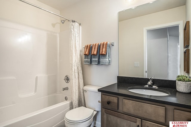 full bathroom featuring shower / bath combo with shower curtain, vanity, and toilet