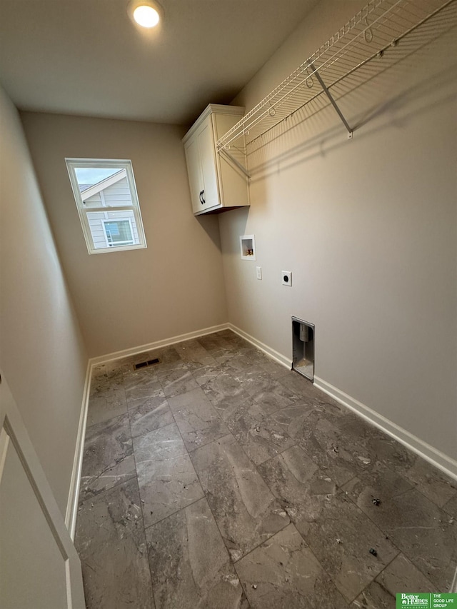 laundry area with washer hookup, hookup for an electric dryer, and cabinets