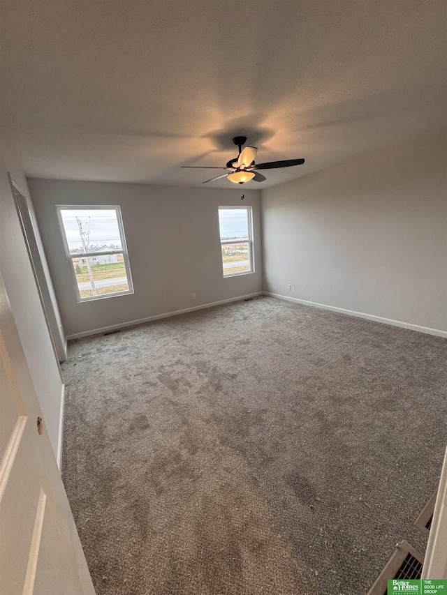 empty room with carpet and ceiling fan