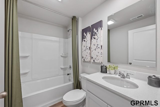 full bathroom with vanity, wood-type flooring, shower / bath combo, and toilet