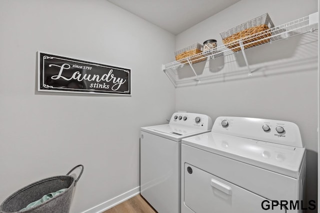 washroom featuring washer and dryer and hardwood / wood-style floors