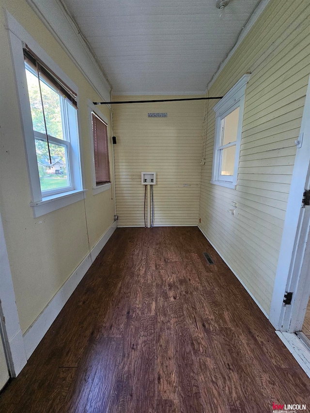 unfurnished room with wood-type flooring