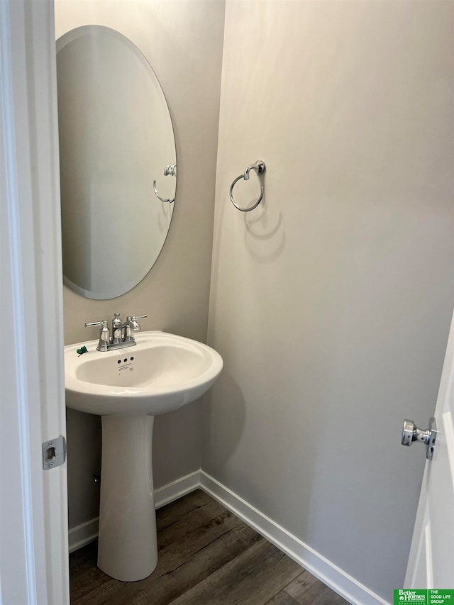 bathroom with hardwood / wood-style flooring