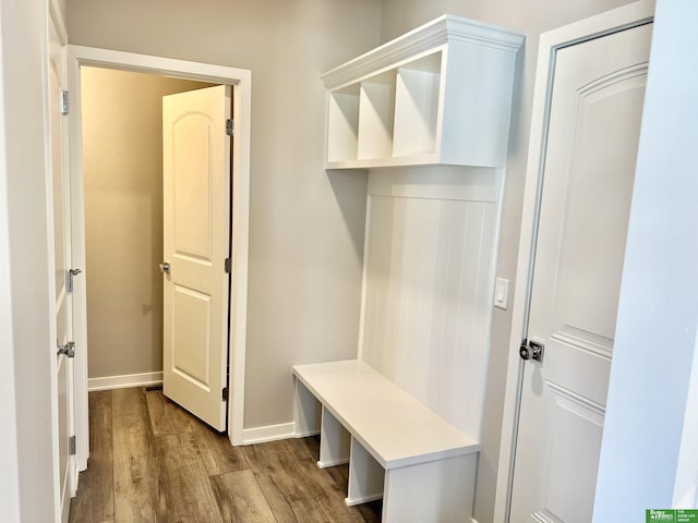 mudroom featuring wood finished floors and baseboards