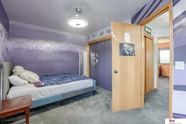 bedroom featuring carpet floors, a closet, and vaulted ceiling