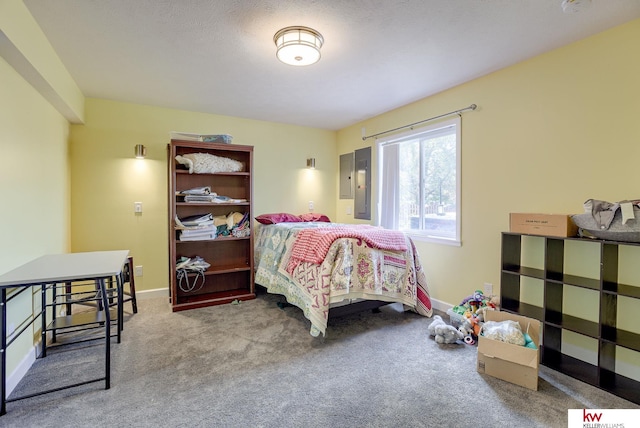 carpeted bedroom featuring a textured ceiling