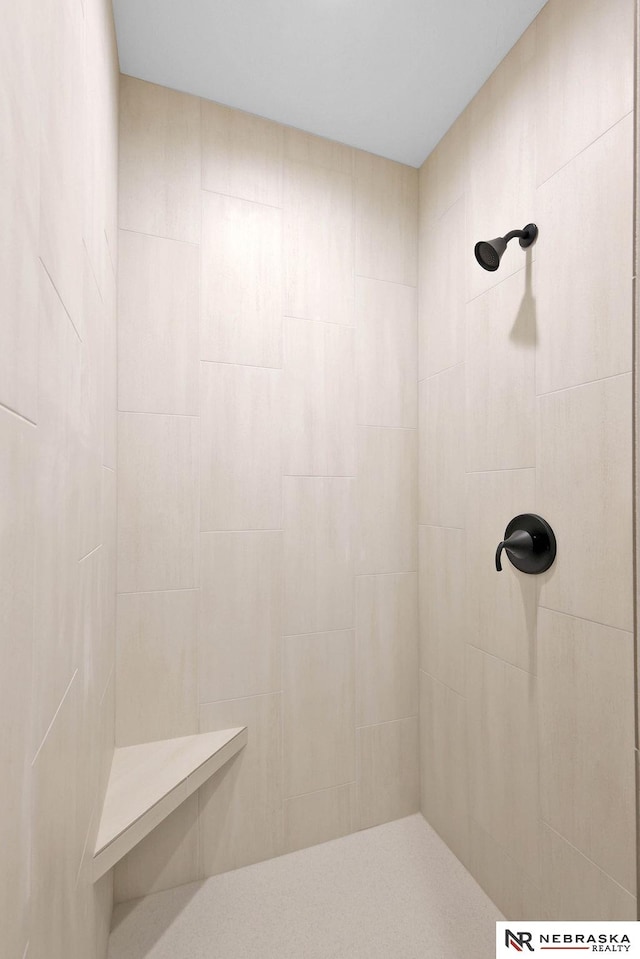 bathroom with tiled shower