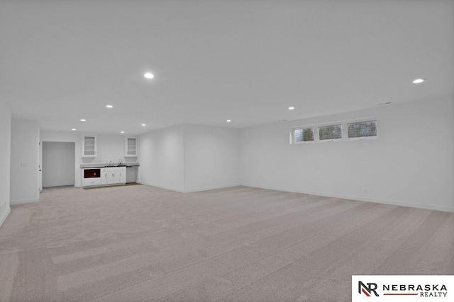 unfurnished living room with light carpet