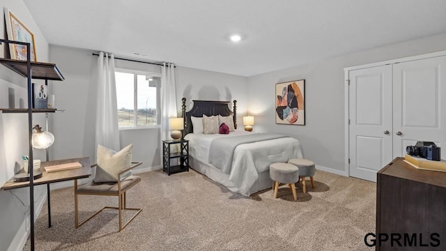 bedroom featuring light colored carpet