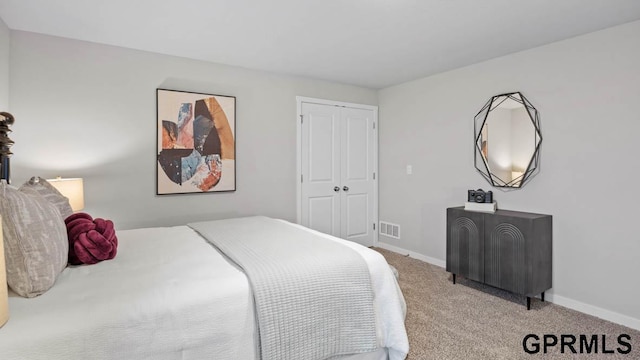 bedroom with carpet flooring and a closet