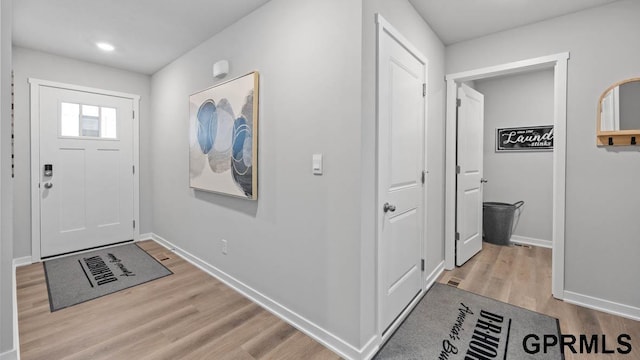 foyer with light wood-type flooring