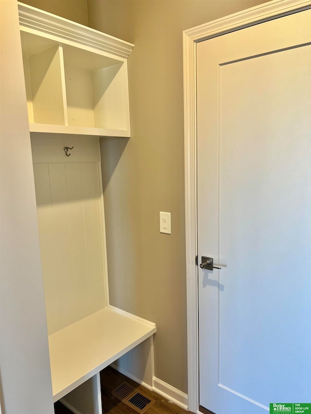 mudroom with dark hardwood / wood-style flooring