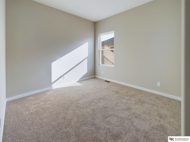 view of carpeted spare room