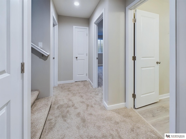 corridor with light carpet