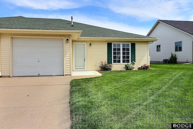 single story home featuring central air condition unit, a front yard, and a garage