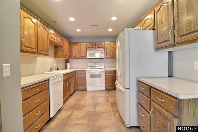 kitchen with white appliances and sink