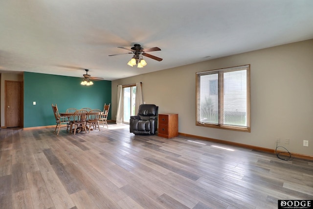 interior space featuring light hardwood / wood-style floors and ceiling fan