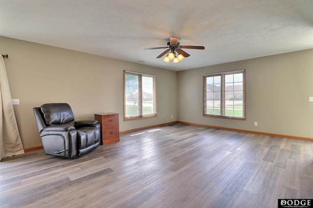 unfurnished room featuring ceiling fan and light hardwood / wood-style flooring