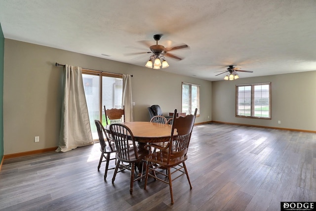 dining space with hardwood / wood-style flooring and ceiling fan