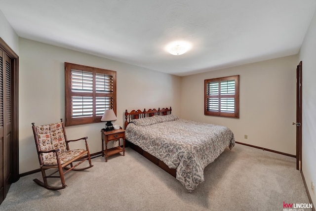 carpeted bedroom featuring a closet