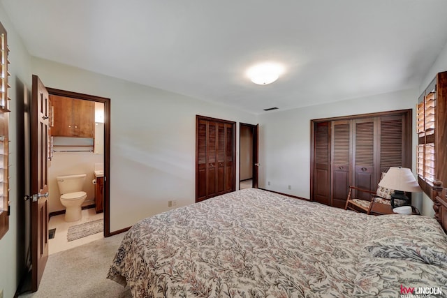 bedroom featuring carpet floors and connected bathroom