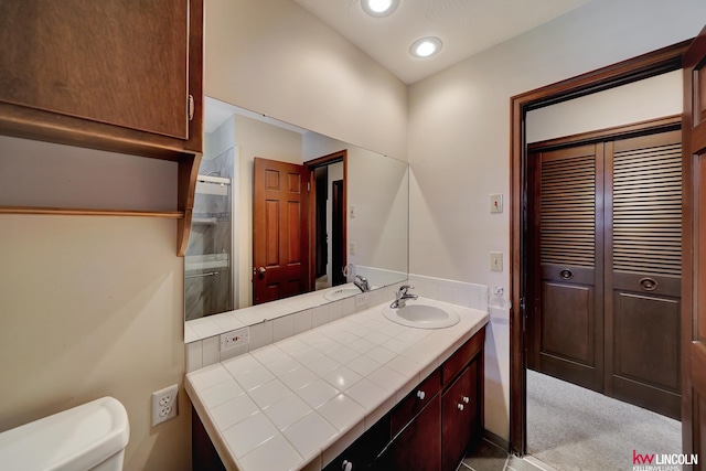 bathroom featuring toilet and vanity