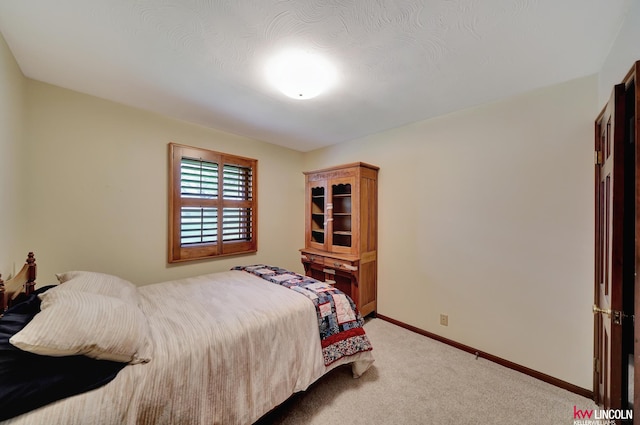 bedroom featuring carpet