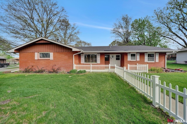 single story home with a front lawn