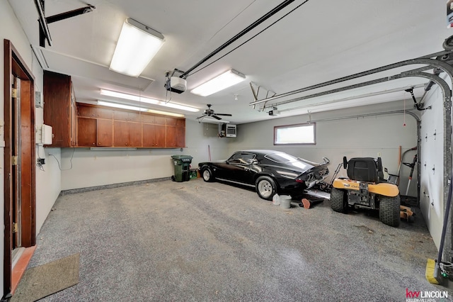 garage featuring a garage door opener and ceiling fan