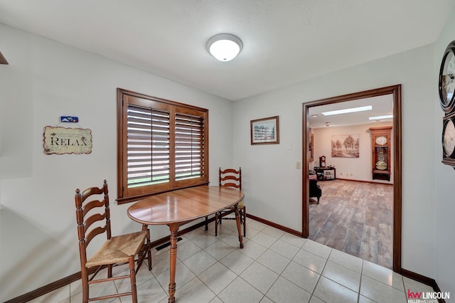 dining space with light tile patterned floors