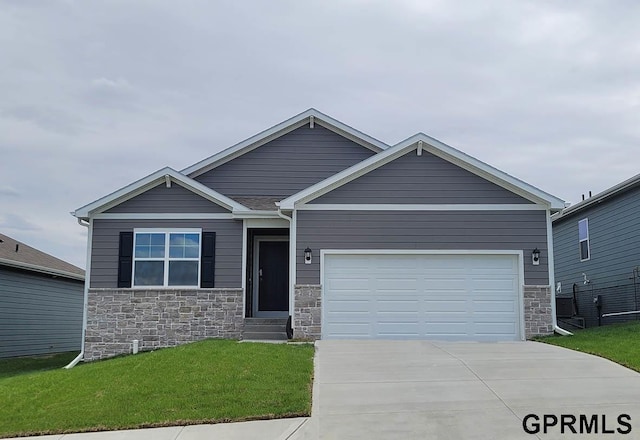 craftsman-style house with a garage and a front lawn