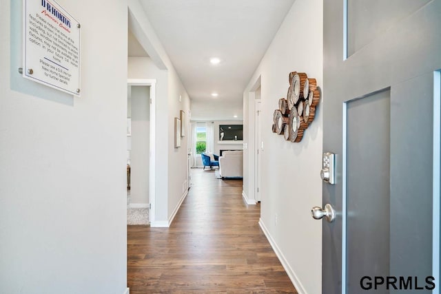 hall with wood-type flooring