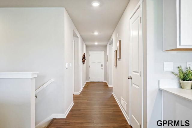 corridor with dark hardwood / wood-style floors