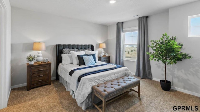 bedroom featuring light carpet