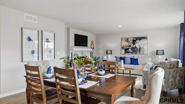 dining space featuring wood-type flooring