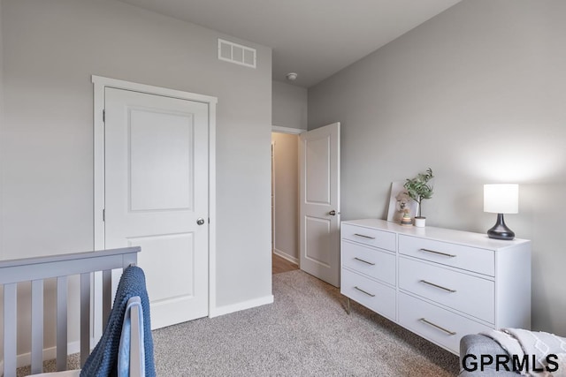 bedroom with light colored carpet