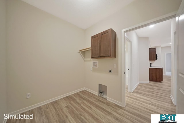 laundry area with washer hookup, electric dryer hookup, cabinets, and light hardwood / wood-style floors